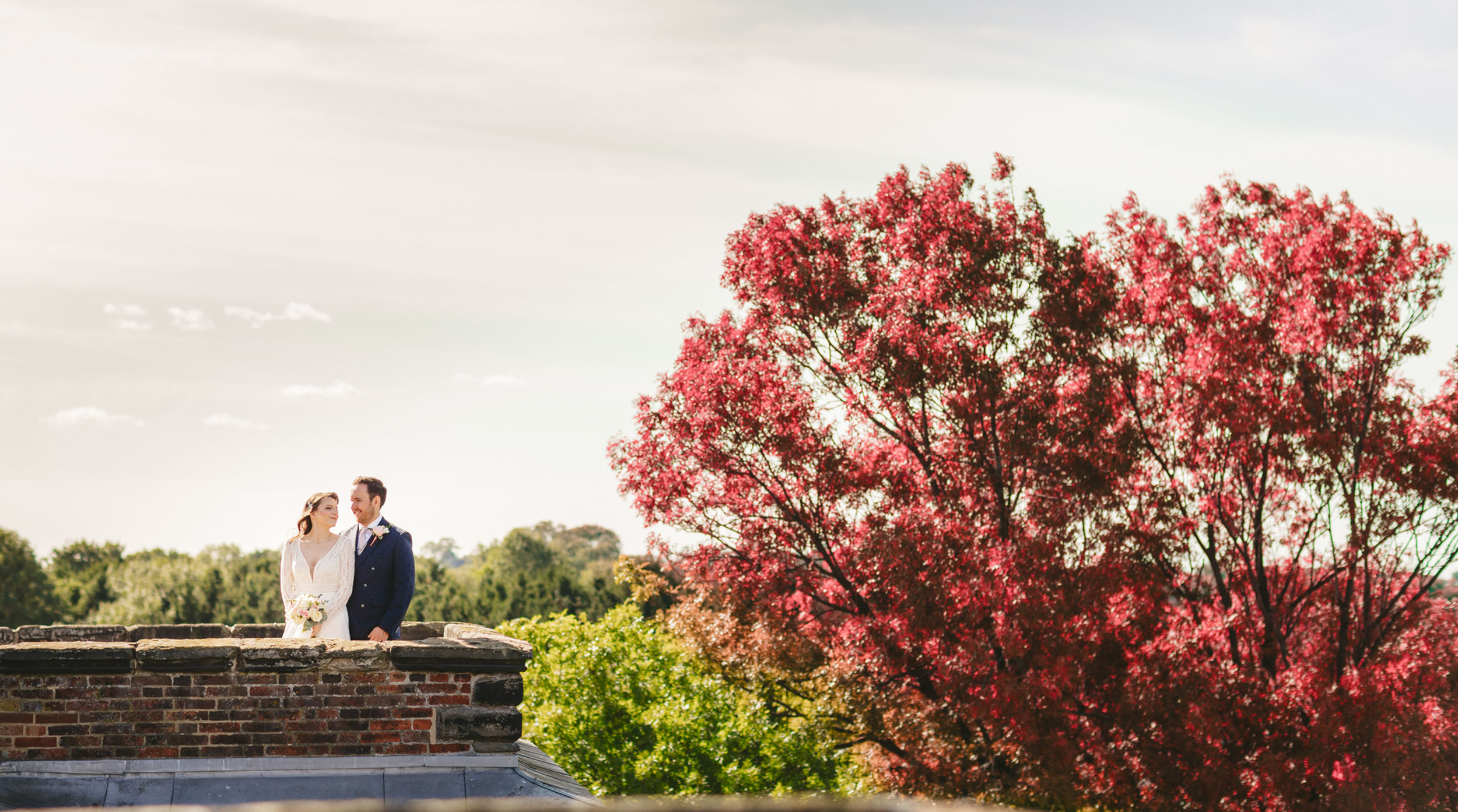 bride and groom on castle roof top - cheap wedding photography