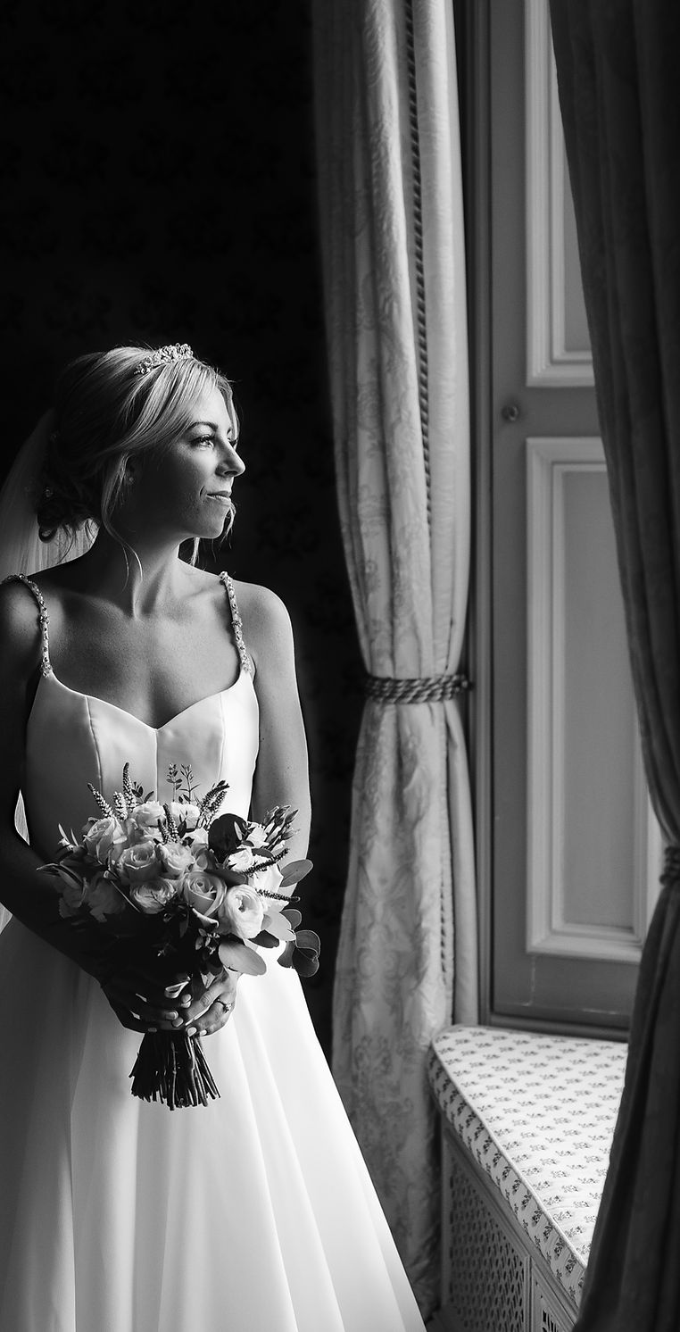 bride to be looking out window before she gets married